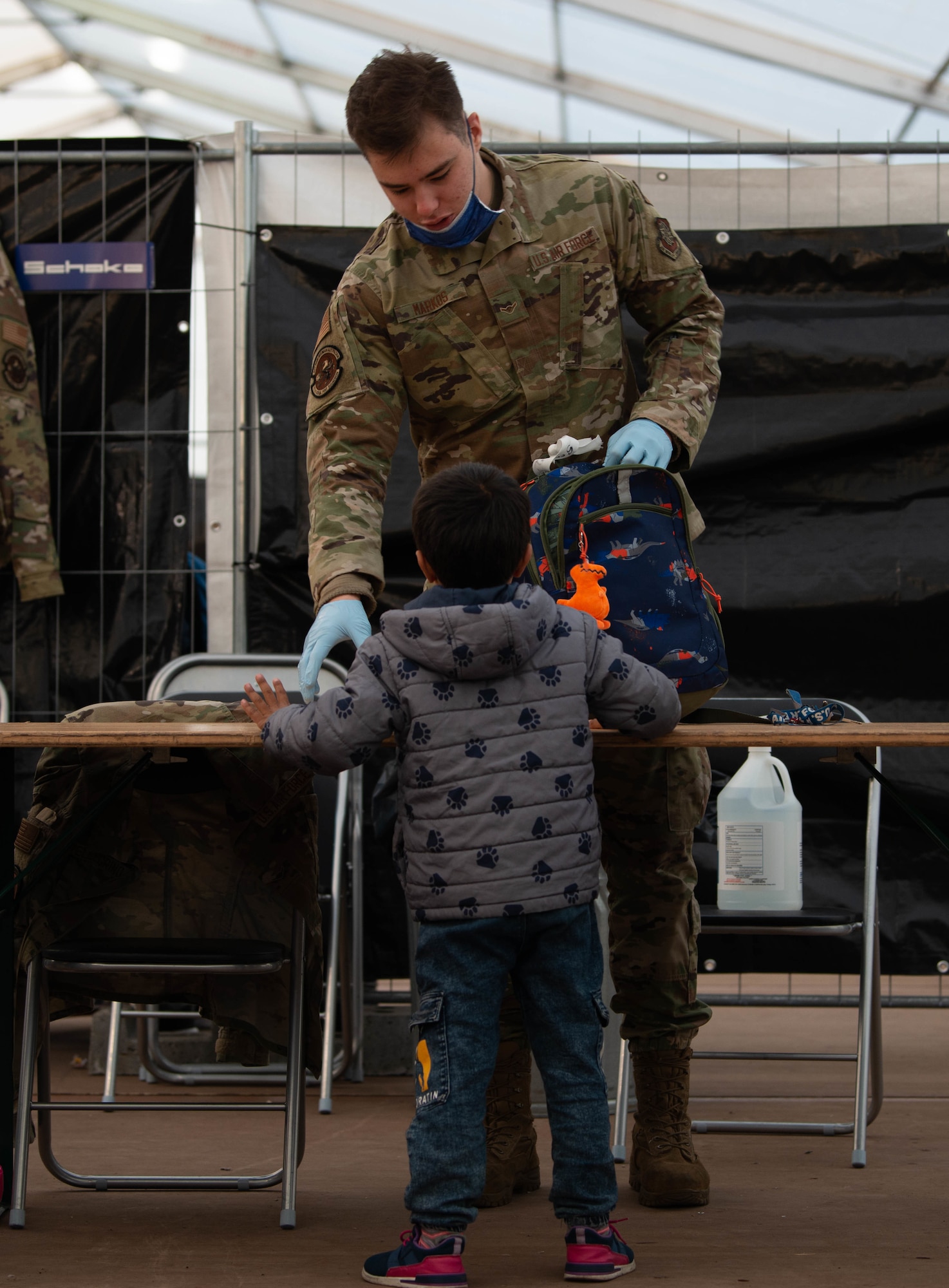 Airman checks luggage.