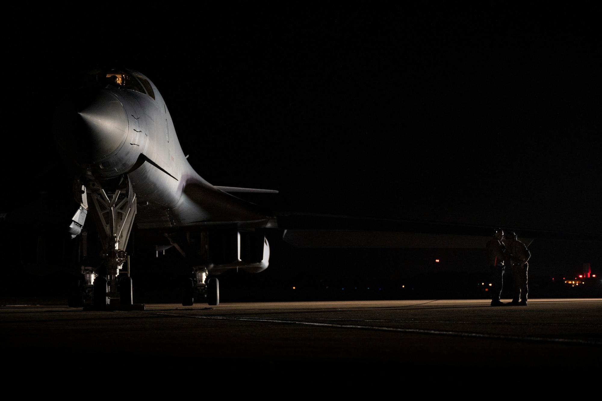 Two crew chiefs assigned to the 9th Expeditionary Bomb Squadron prepare a B-1B Lancer for take-off at Raf Fairford, United Kingdom, Oct. 11, 2021. Two B-1’s participated in a Bomber Task Force Europe training mission where the aircrews integrated with allied Joint Terminal Attack Controllers over Lithuania before conducting a hot pit refueling at Spangdahlem Air Base, Germany. (U.S. Air Force photo by Senior Airman Colin Hollowell)