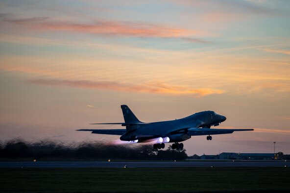Two crew chiefs assigned to the 9th Expeditionary Bomb Squadron prepare a B-1B Lancer for take-off at Raf Fairford, United Kingdom, Oct. 11, 2021. Two B-1’s participated in a Bomber Task Force Europe training mission where the aircrews integrated with allied Joint Terminal Attack Controllers over Lithuania before conducting a hot pit refueling at Spangdahlem Air Base, Germany. (U.S. Air Force photo by Senior Airman Colin Hollowell)