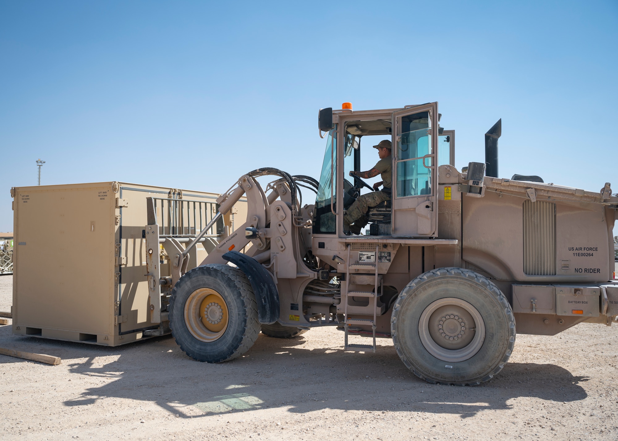 U.S. Air Force Staff Sgt. Robert Ignacio, assigned to the 443rd Air Expeditionary Squadron, moves cargo at Al Asad Air Base, Iraq, Sept. 22, 2021.
