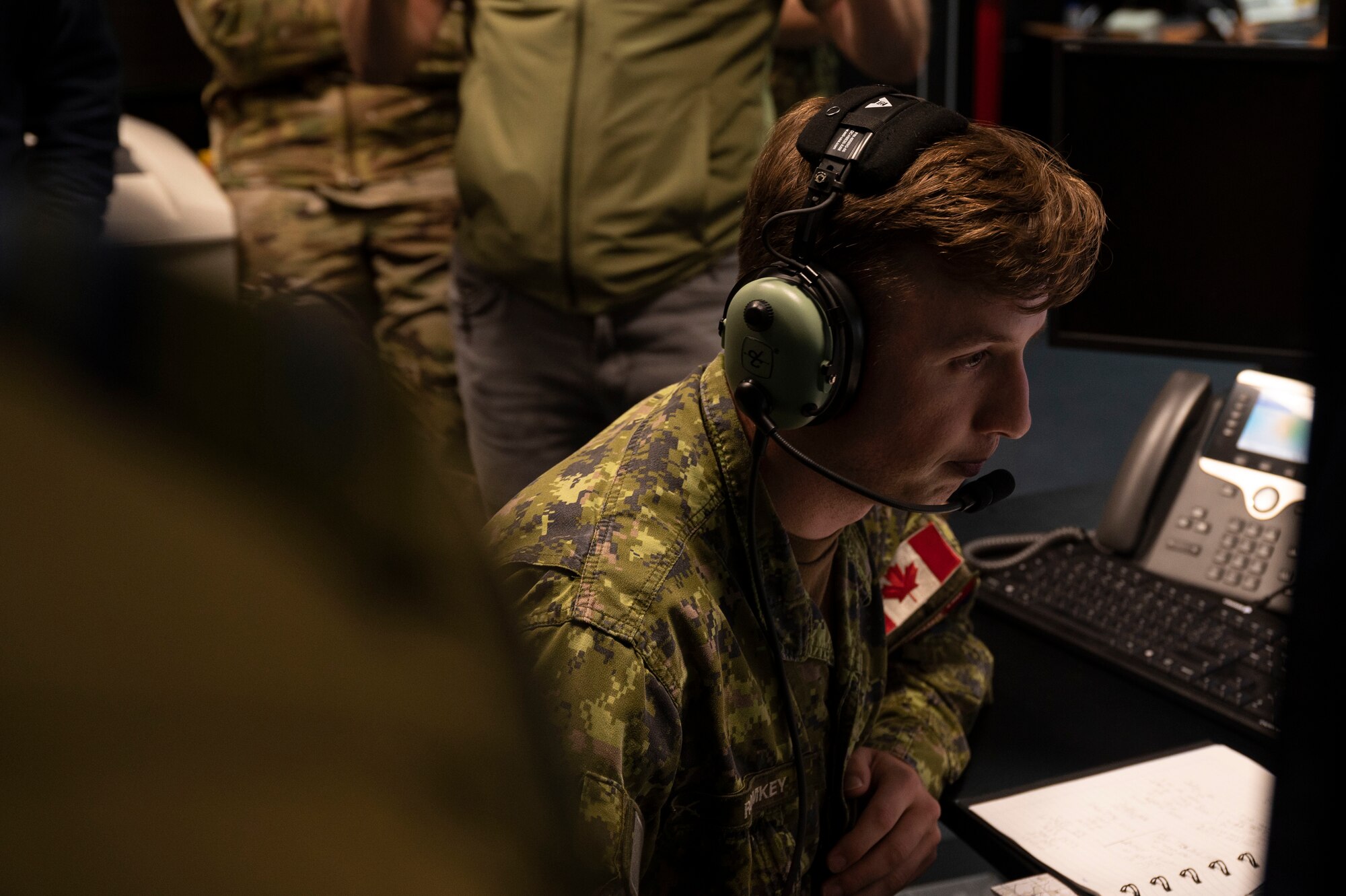 A Canadian terminal attack controller speaks into a headset during exercise Spartan Bigfoot 21 at Einsiedlerhof Air Station