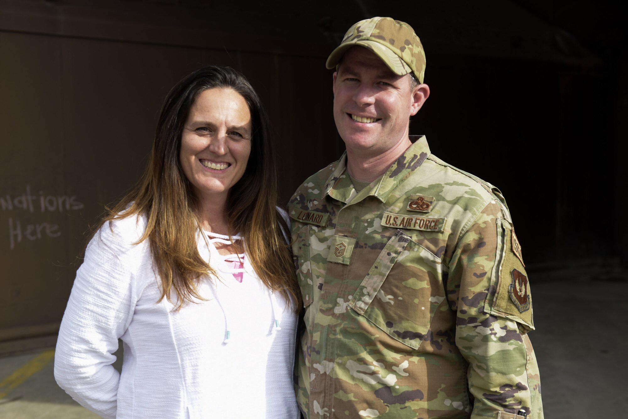 Master Sgt. Daniel Leonard and his wife Heather Leonard stand outside