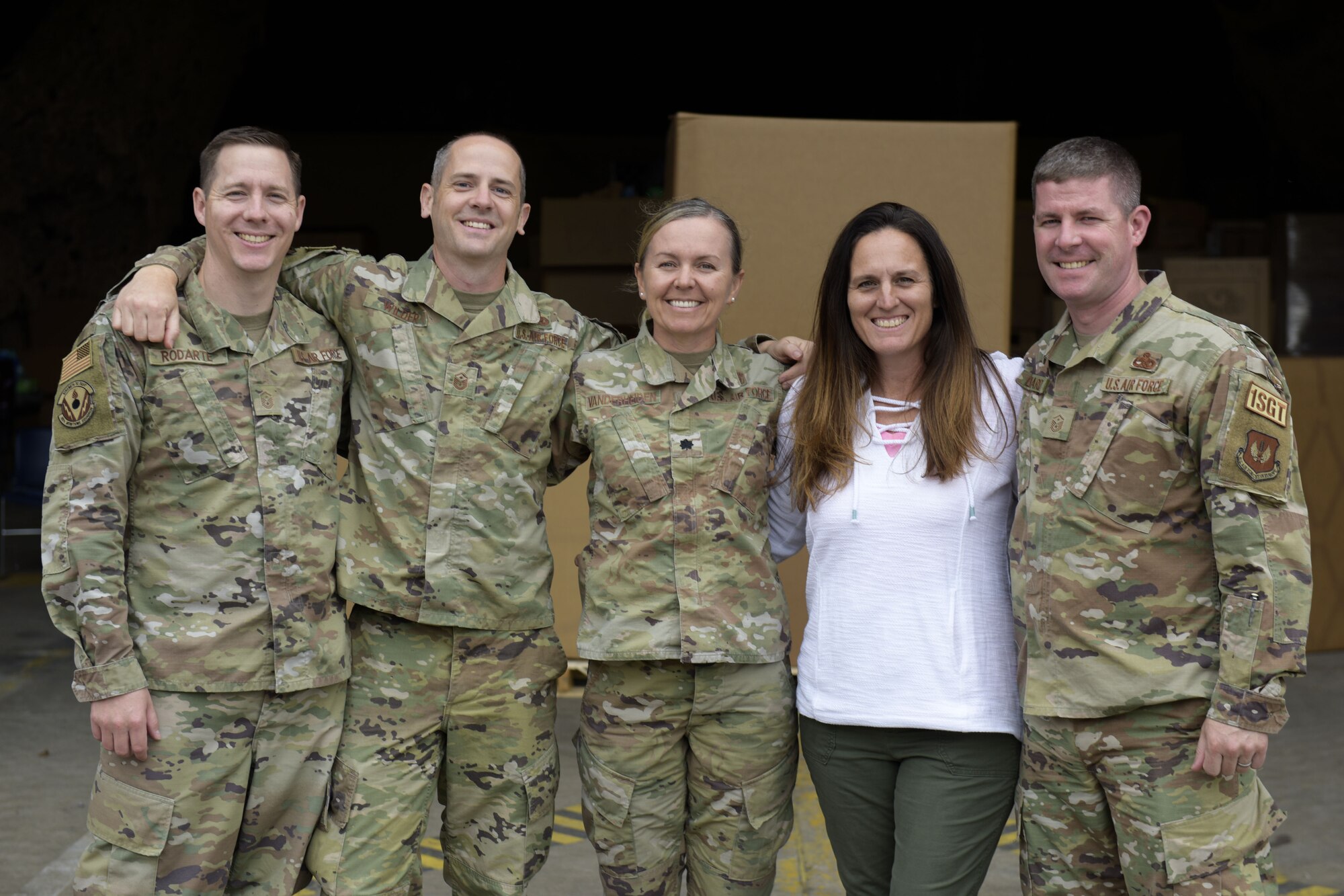 Members of donation team stand outside