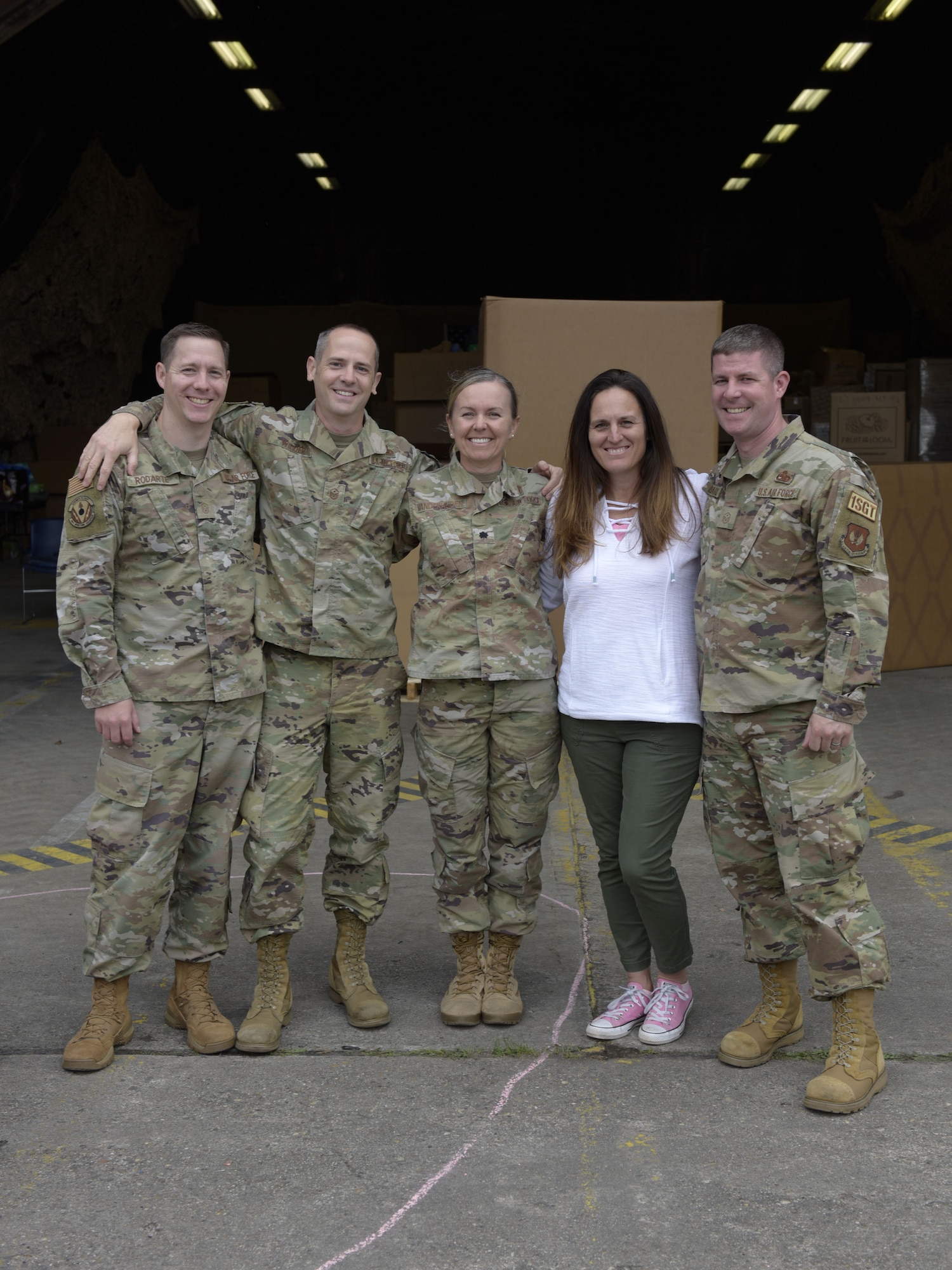Members of donation team stand outside