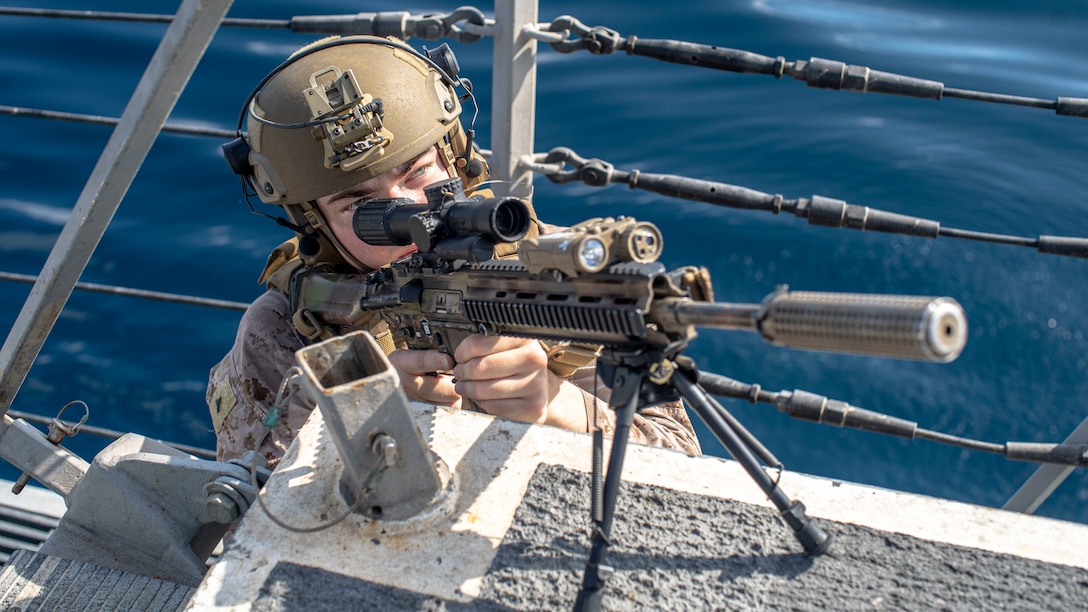 ARABIAN SEA (Oct. 7, 2021) Marine Corps Lance Cpl. David Wells, a rifleman assigned to Alpha Company, Battalion Landing Team 1/1, 11th Marine Expeditionary Unit (MEU), posts security on the flight deck during an interior and exterior clearing exercise aboard amphibious transport dock USS Portland (LPD 27), Oct. 7. Portland and the 11th MEU are deployed to the U.S. 5th Fleet area of operations in support of naval operations to ensure maritime stability and security in the Central Region, connecting the Mediterranean and Pacific through the Western Indian Ocean and three strategic choke points. (U.S. Marine Corps photo by Lance Cpl. Patrick Katz/Released)