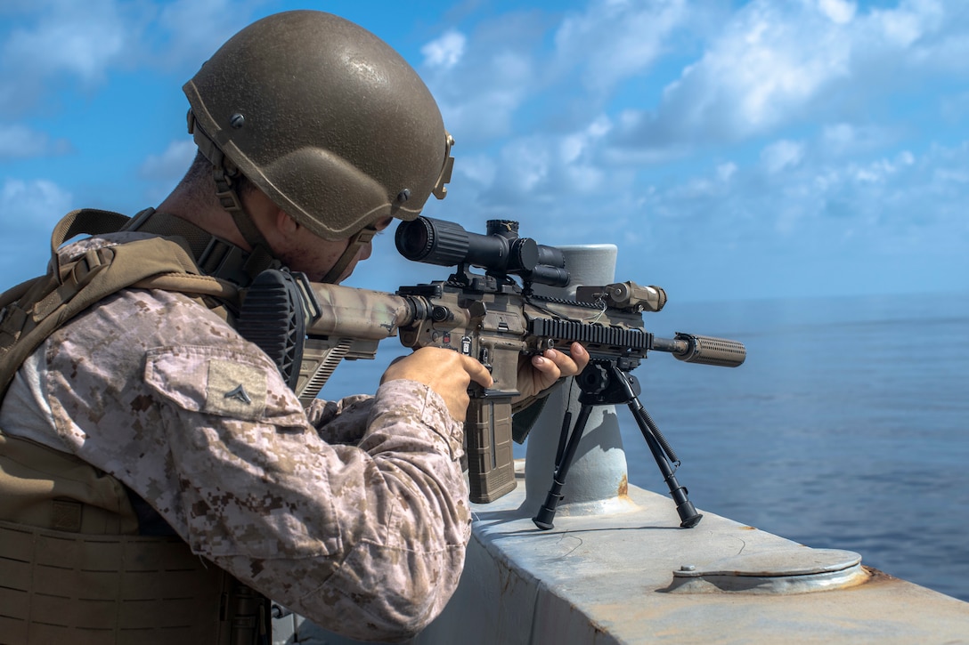 ARABIAN SEA (Oct. 7, 2021) Marine Corps Lance Cpl. Tyson Johnson, a rifleman assigned to Alpha Company, Battalion Landing Team 1/1, 11th Marine Expeditionary Unit (MEU), holds security during an interior and exterior clearing exercise aboard amphibious transport dock USS Portland (LPD 27), Oct. 7. Portland and the 11th MEU are deployed to the U.S. 5th Fleet area of operations in support of naval operations to ensure maritime stability and security in the Central Region, connecting the Mediterranean and Pacific through the Western Indian Ocean and three strategic choke points. (U.S. Marine Corps photo by Lance Cpl. Patrick Katz/Released)