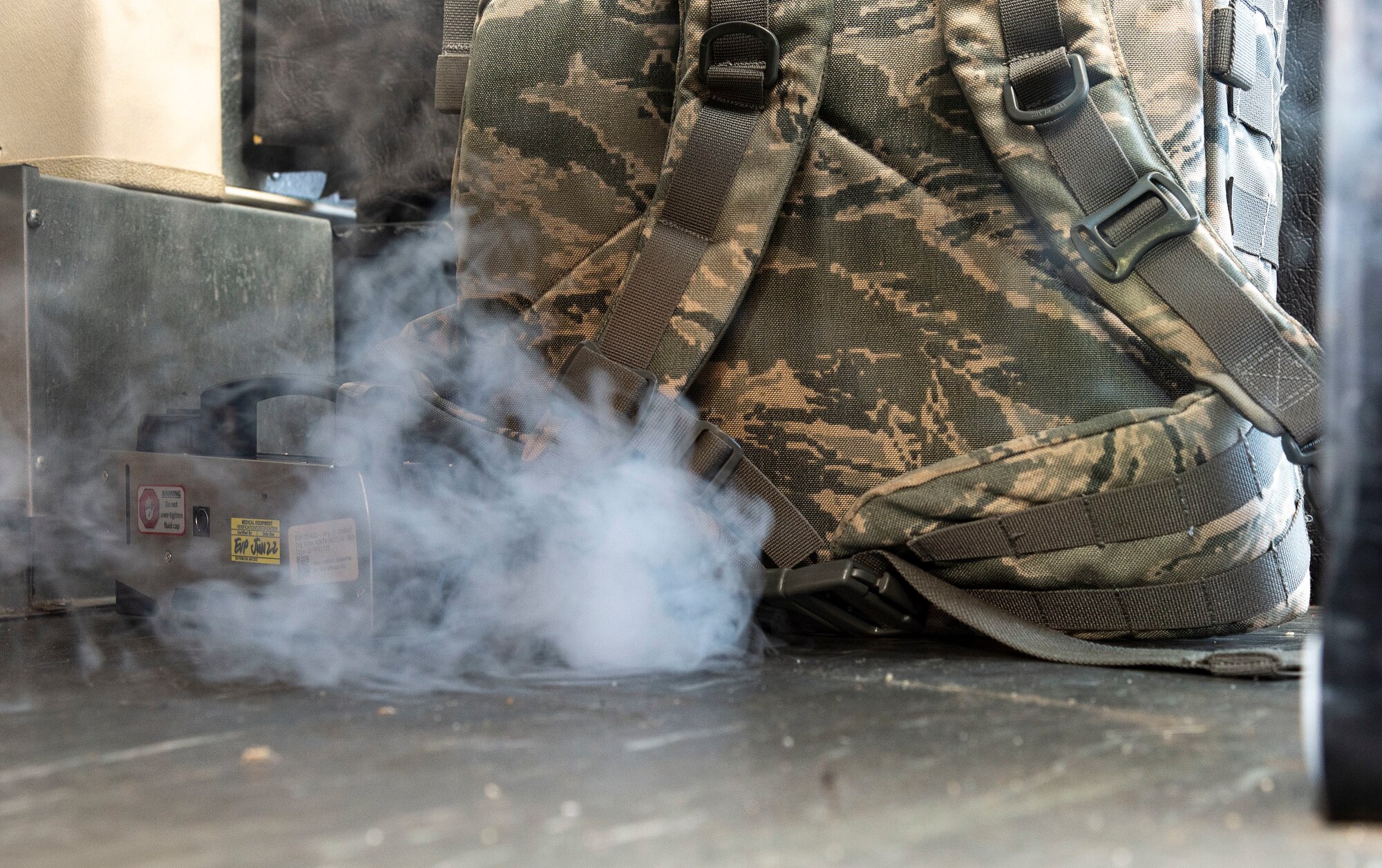 A backpack emits a simulated unknown chemical during a Force Protection Major Accident Response Exercise at Dover Air Force Base, Delaware, Oct. 7, 2021. The three-day exercise tested the response capabilities of Team Dover through various scenarios in an effort to strengthen their ability to provide rapid-global mobility in challenging conditions. (U.S. Air Force photo by Roland Balik)