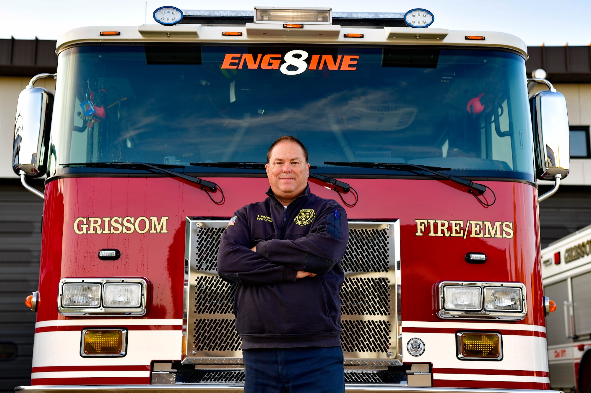 John Ireland, Grissom fire chief, poses in front of a fire truck at Grissom Air Reserve Base, Indiana, Oct. 13, 2021. Ireland won the Indiana Emergency Responders Conference Fire Chief of the Year award. (U.S. Air Force photo by Staff Sgt. Jeremy Blocker)