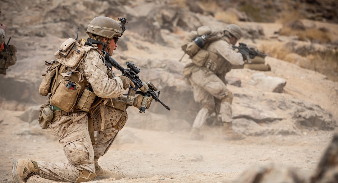 U.S. Marines with 2nd Battalion, 3rd Marine Regiment, 3rd Marine Division advance to their objective while conducting Range 400 at Marine Corps Air Ground Combat Center Twentynine Palms, California, Feb. 1, 2021. Range 400 is a training event that takes place during an integrated training exercise (ITX). An ITX is a 28-day training evolution that involves a series of progressive live-fire exercises that assess the ability and adaptability of a force of more than 3,500 Marines and sailors. (U.S. Marine Corps Photo by Lance Cpl. Quince Bisard)