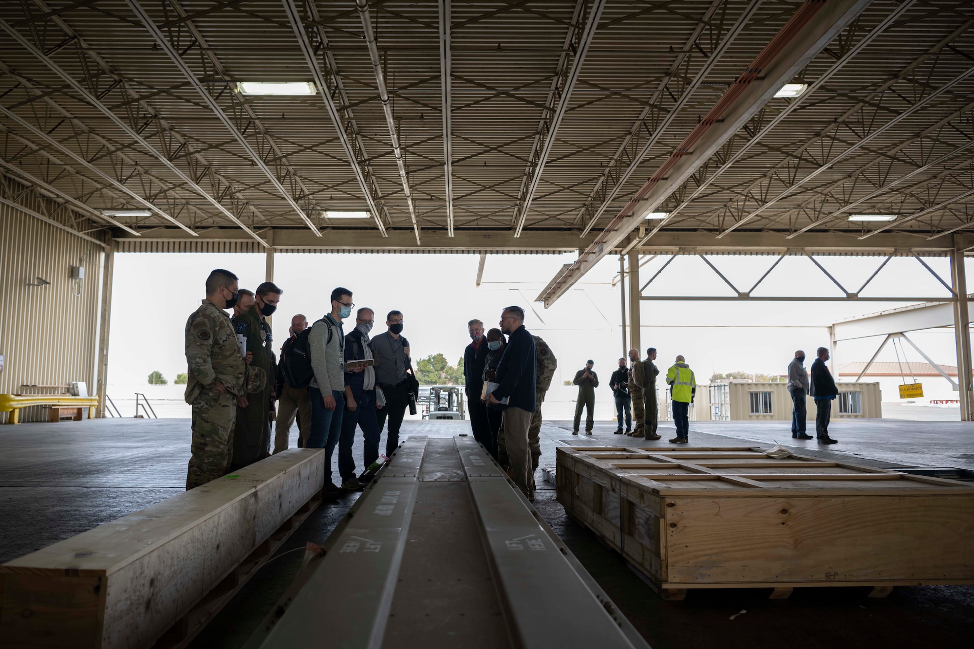 people tour a warehouse