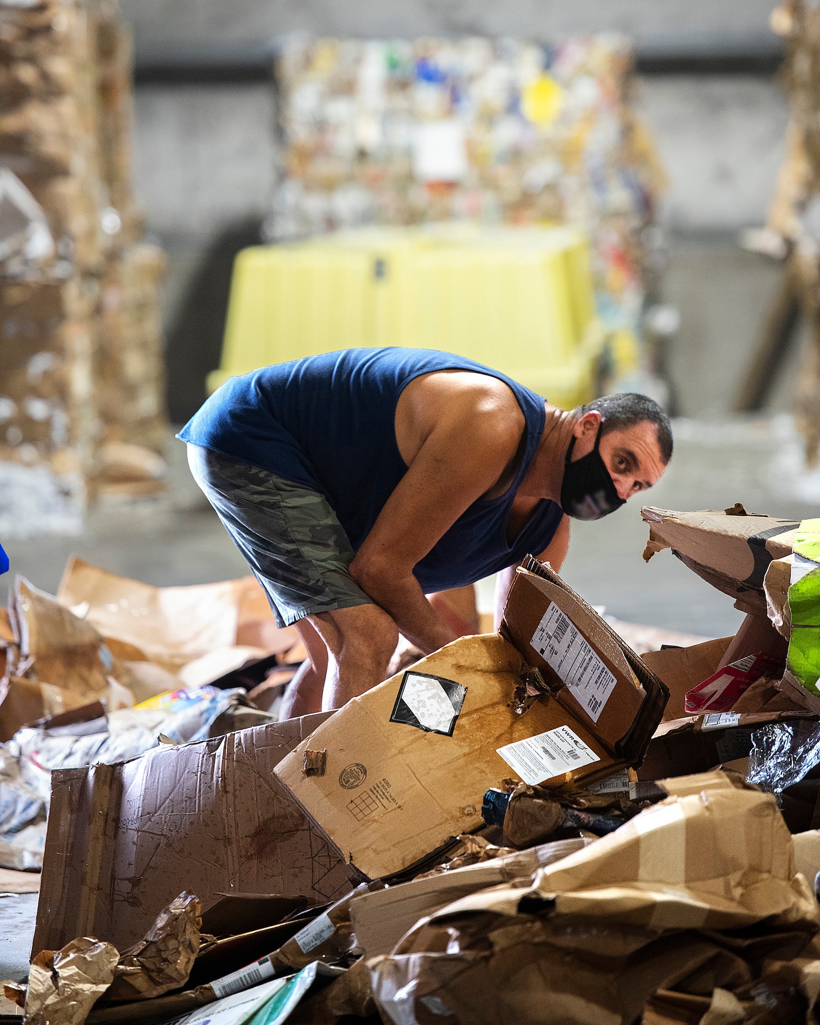 Ned Applegate, 88th Force Support Squadron, sorts through a pile of cardboard Sept. 22, 2021, in the Recycling Center at Wright-Patterson Air Force Base, Ohio. The center is run through a memorandum of agreement between 88 FSS and the 88th Civil Engineer Group.  (U.S. Air Force photo by R.J. Oriez)