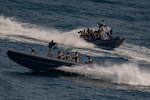Marines assigned to the All Domain Reconnaissance Detachment boat team, 11th Marine Expeditionary Unit (MEU), conduct maritime navigation training aboard rigid inflatable boats, Oct. 8.