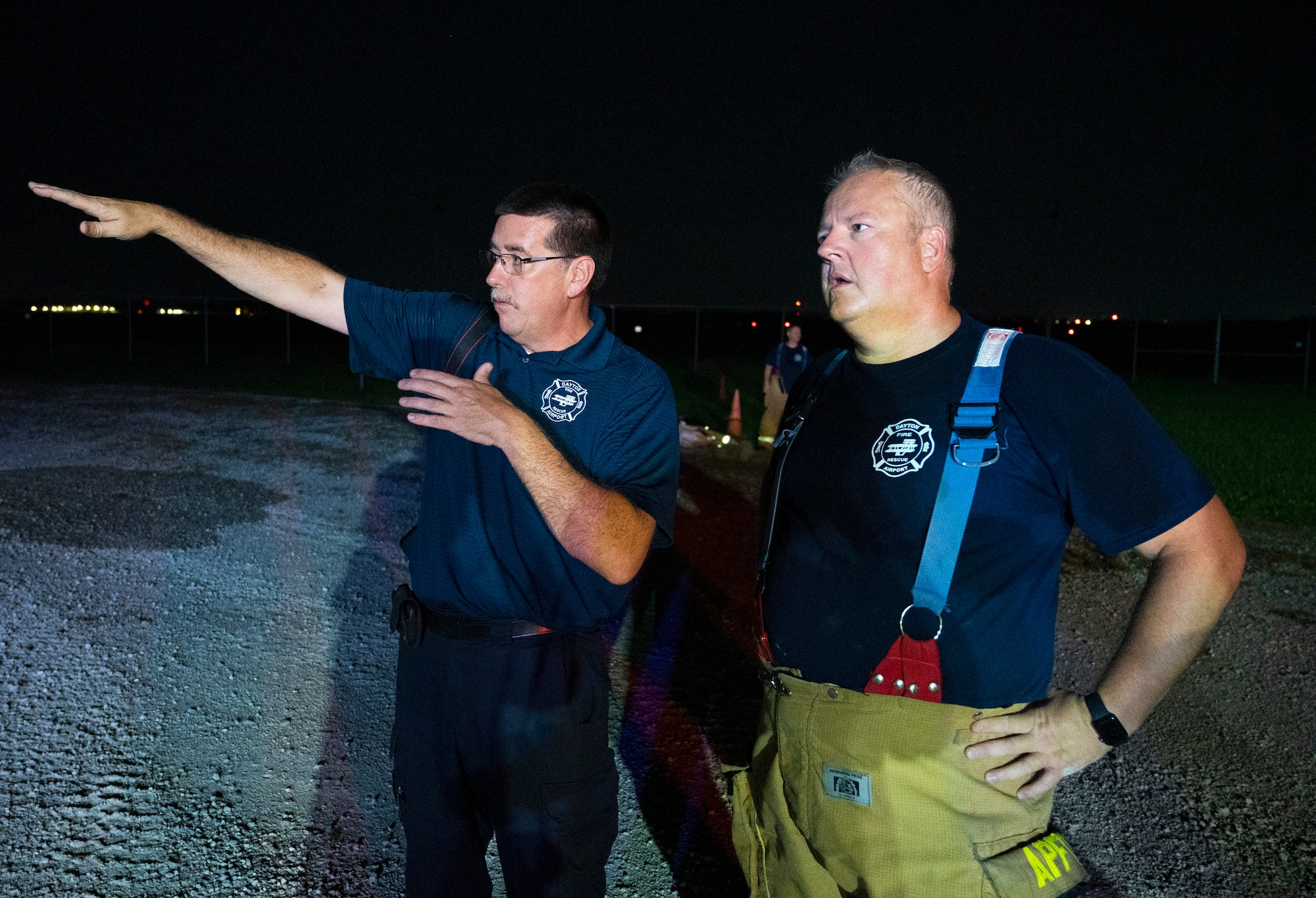 Dayton International Airport Fire Department Chief Duane Stitzel (left) discusses how to attack a blaze with one of his firefighters Oct. 5, 2021, at Wright-Patterson Air Force Base, Ohio. The 788th Civil Engineer Squadron Fire Department assisted the DIA Fire Department in refresher training required for Federal Aviation Administration certification. (U.S. Air Force photo by R.J. Oriez)