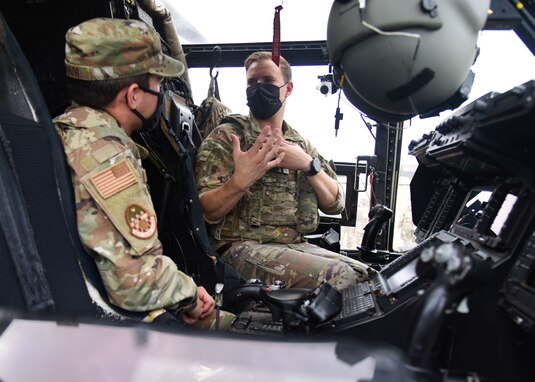 U.S. Air Force Capt. Seth Smith, 20th Special Operations Squadron aircraft commander, talks to a Goodfellow member about the instruments located in the cockpit of a CV-22 Osprey