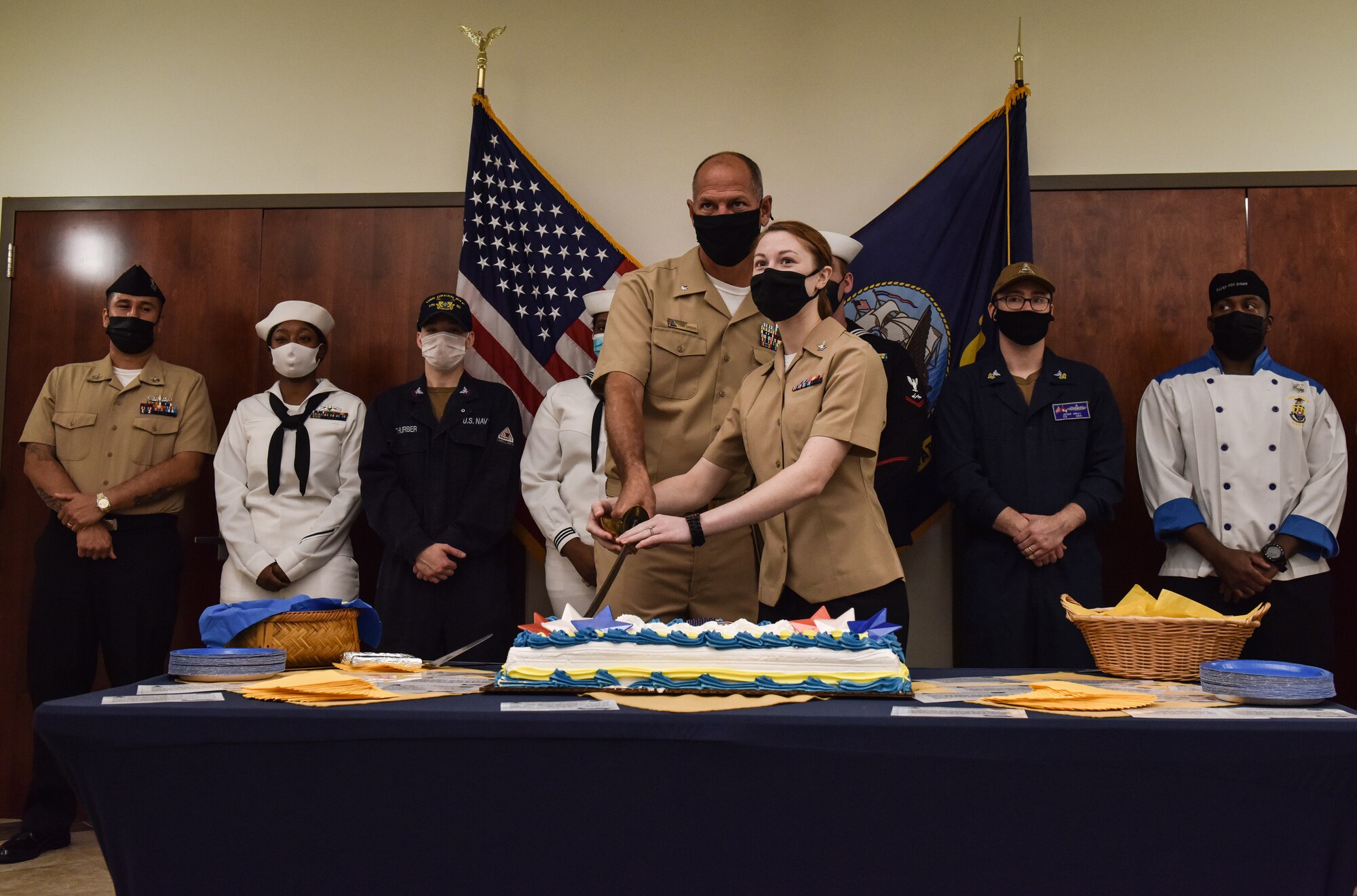 The most senior and junior Sailor in attendance cut the cake together during a ceremony celebrating the U.S. Navy’s 246th birthday at Joint Base McGuire-Dix-Lakehurst, N.J., Oct. 13, 2021. The senior and junior Sailor cutting the cake is a tradition that symbolizes experienced Sailors leading younger Sailors that will become the future of the Navy. (U.S. Air Force photo by Staff Sergeant Shay Stuart)