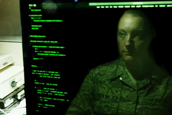 An employee looks at a computer screen.