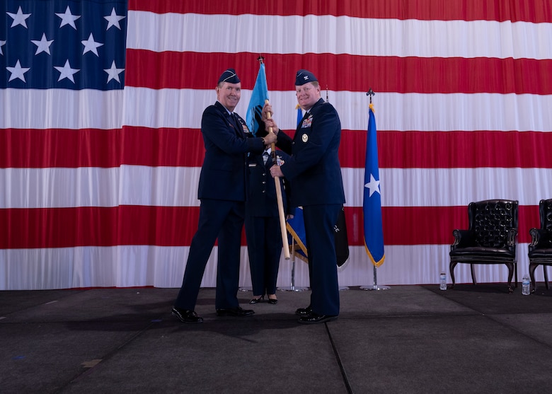 PETERSON SPACE FORCE BASE, Colo. – U.S. Space Force Brig. Gen. Shawn Bratton, Space Training and Readiness Command commander, passes the Space Delta 10 – Doctrine and Wargaming guidon to U.S. Space Force Col. Jack D. Fulmer II, DEL 10 commander, during the activation ceremony at Peterson Space Force Base, Colorado, Sept. 30, 2021. DEL 10 is temporarily located at the United States Air Force Academy until the completion of the Department of the Air Force’s Strategic Basing Process is completed and approved by the Secretary of the Air Force. (U.S. Space Force photo by Staff Sgt. Matthew Coleman-Foster)