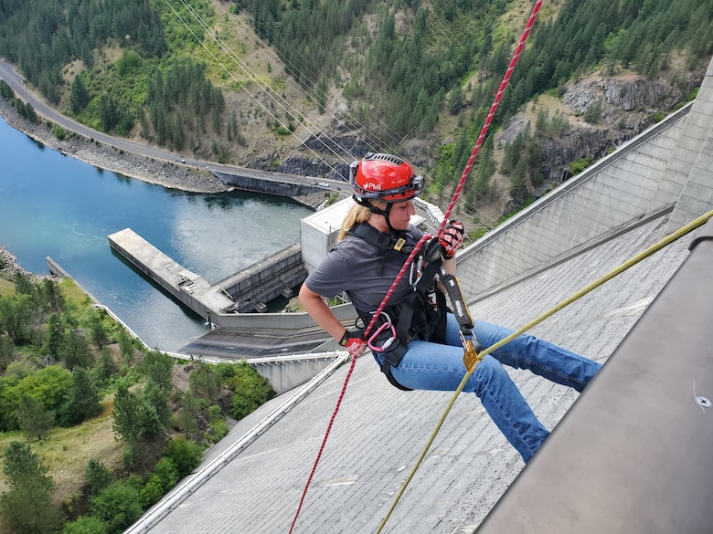 Noel Wise​, Hydropower Intern and 2021 Washington State University graduate rappels down the face of Dworshak Dam during a Rescue Team training drill. Wise is an Electrical Engineer intern.