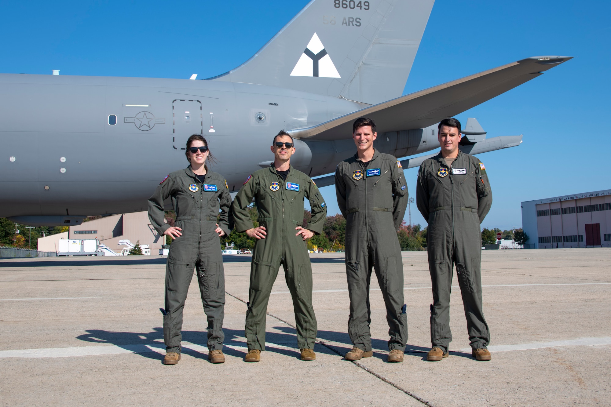 U.S. Air Force aircrew of the KC-46 Pegasus flyover team for the funeral of U.S. Army Air Forces Lt. Earnest Vienneau, 97th Bombardment Group (BW), stands next to their aircraft at Pease Air National Guard Base, New Hampshire, Oct. 8, 2021. Over time, the 97th BW  became the 97th Air Mobility Wing that these Airmen are members of. (U.S. Air Force photo by Staff Sgt. Cody Dowell)