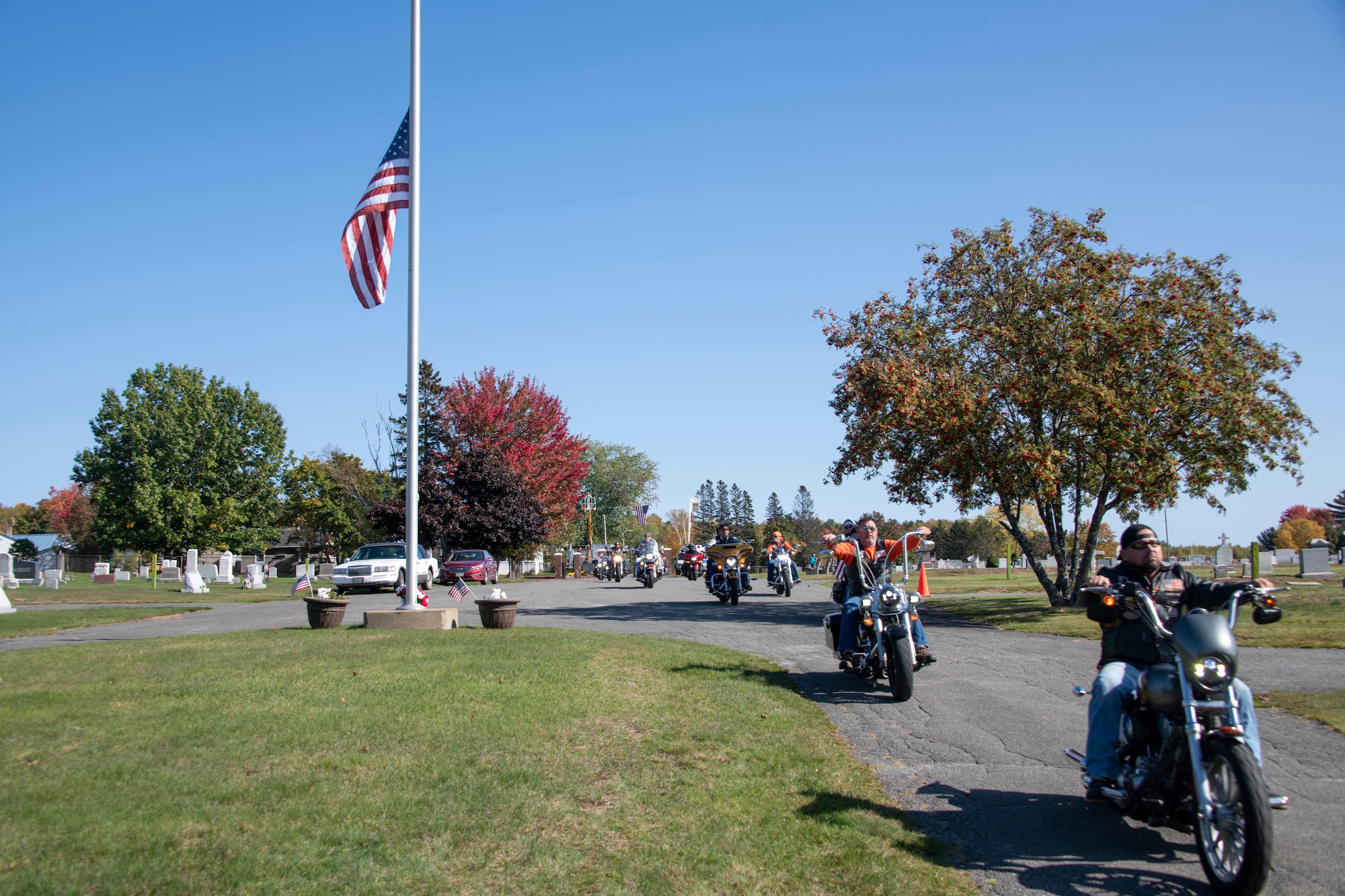 Motorcyclists from the Patriot Riders escort the funeral procession team for the funeral of U.S. Army Air Forces 2nd Lt. Earnest Vienneau, 97th Bombardment Group, at Millinocket, Maine, Oct. 9, 2021. Groups like this form a voluntary honor guard at military burials, to help protect mourners from harassment and fill out the ranks at burials. (U.S. Air Force photo by Staff Sgt. Cody Dowell)