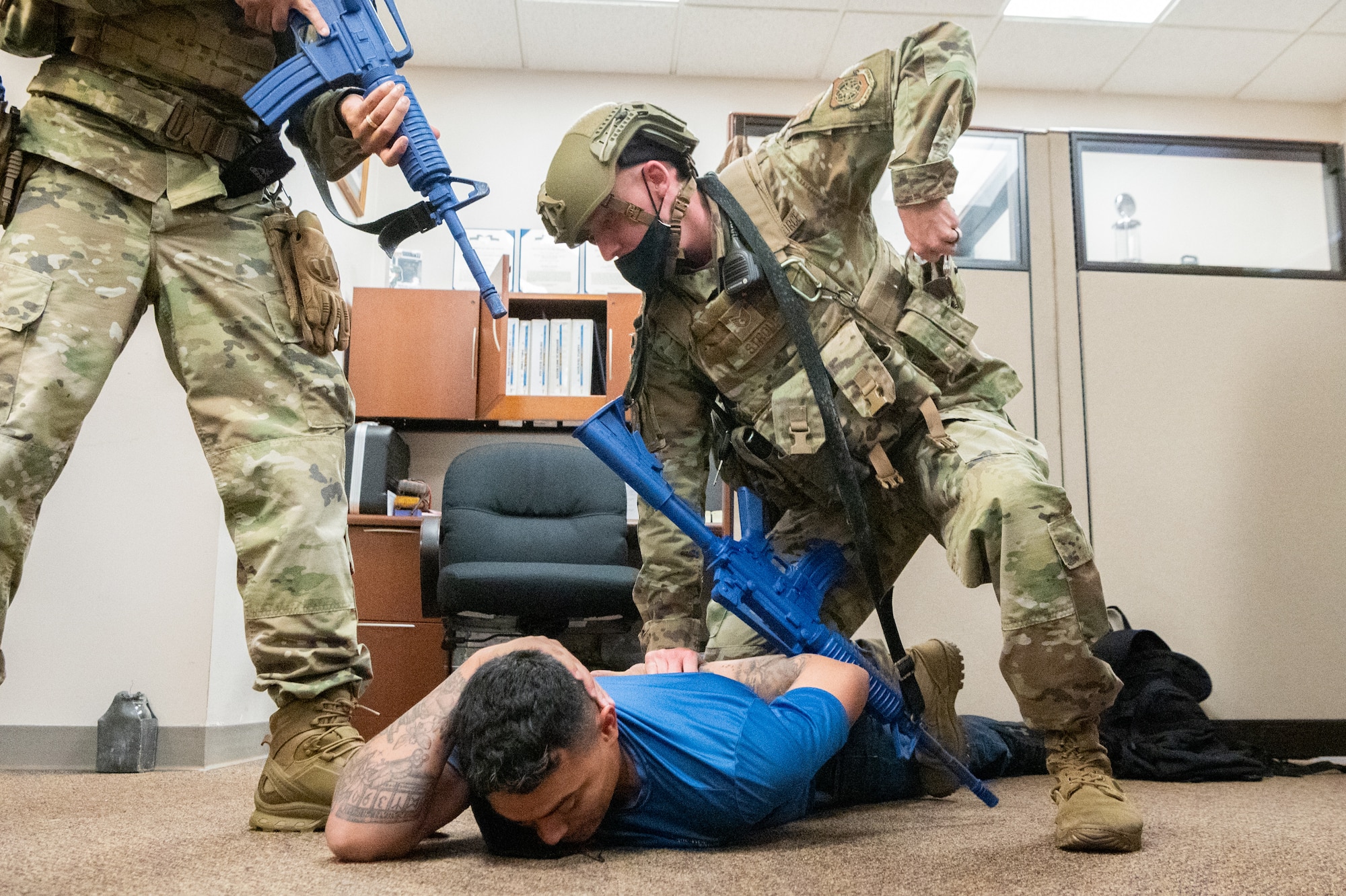 Tech. Sgt. Justen Stroup, 436th Security Forces Squadron response force leader, apprehends an active shooter during a Force Protection Major Accident Response Exercise at Dover Air Force Base, Delaware, Oct. 7, 2021. The three-day exercise tested the resolve of Team Dover through various scenarios in an effort to strengthen their ability to provide rapid-global mobility in challenging conditions. (U.S. Air Force photo by Mauricio Campino)