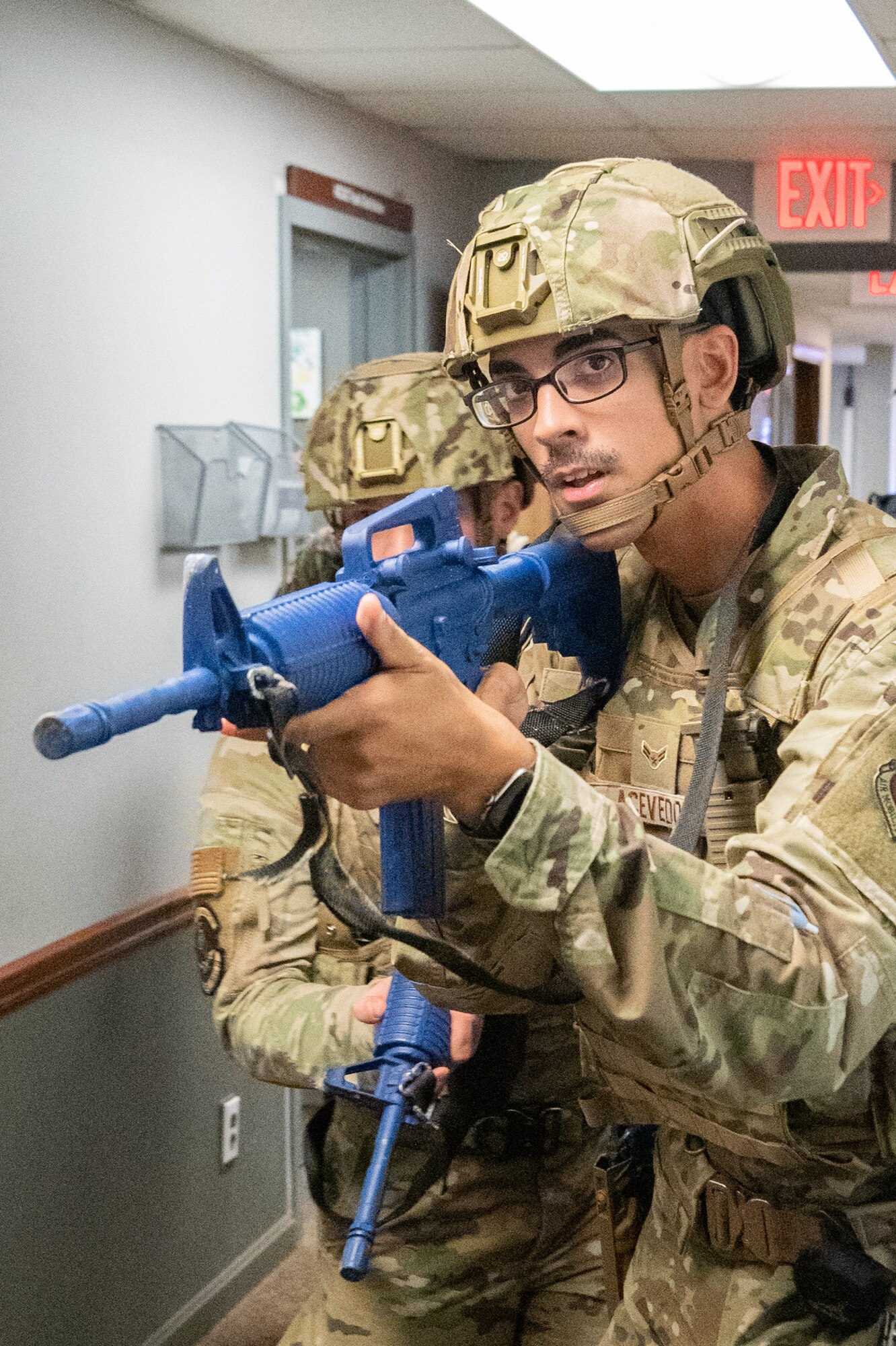 Airman 1st Class Alexis Acevedo, 436th Security Forces Squadron response force member, clears a building in response to a simulated active shooter during a Force Protection Major Accident Response Exercise at Dover Air Force Base, Delaware, Oct. 7, 2021. The three-day exercise tested the resolve of Team Dover through various scenarios in an effort to strengthen their ability to provide rapid-global mobility in challenging conditions. (U.S. Air Force photo by Mauricio Campino)