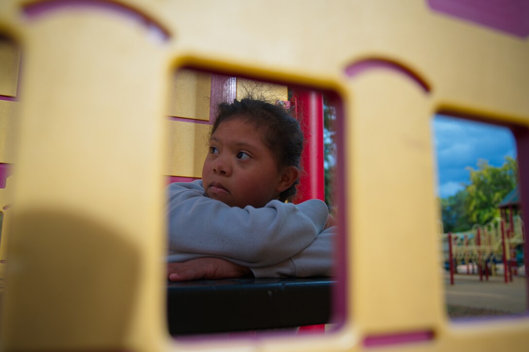Maya Lute, daughter of U.S. Air Force Staff Sgt. Karmalita Phipps, 86th Dental Squadron dental technician, counts during a game of hide-and-seek at Ramstein Air Base, Oct. 5, 2021. October is Down syndrome awareness month. Maya is one of the few children in the Kaiserslautern Military Community with Down syndrome. (U.S. Air Force photo by Senior Airman Branden Rae)