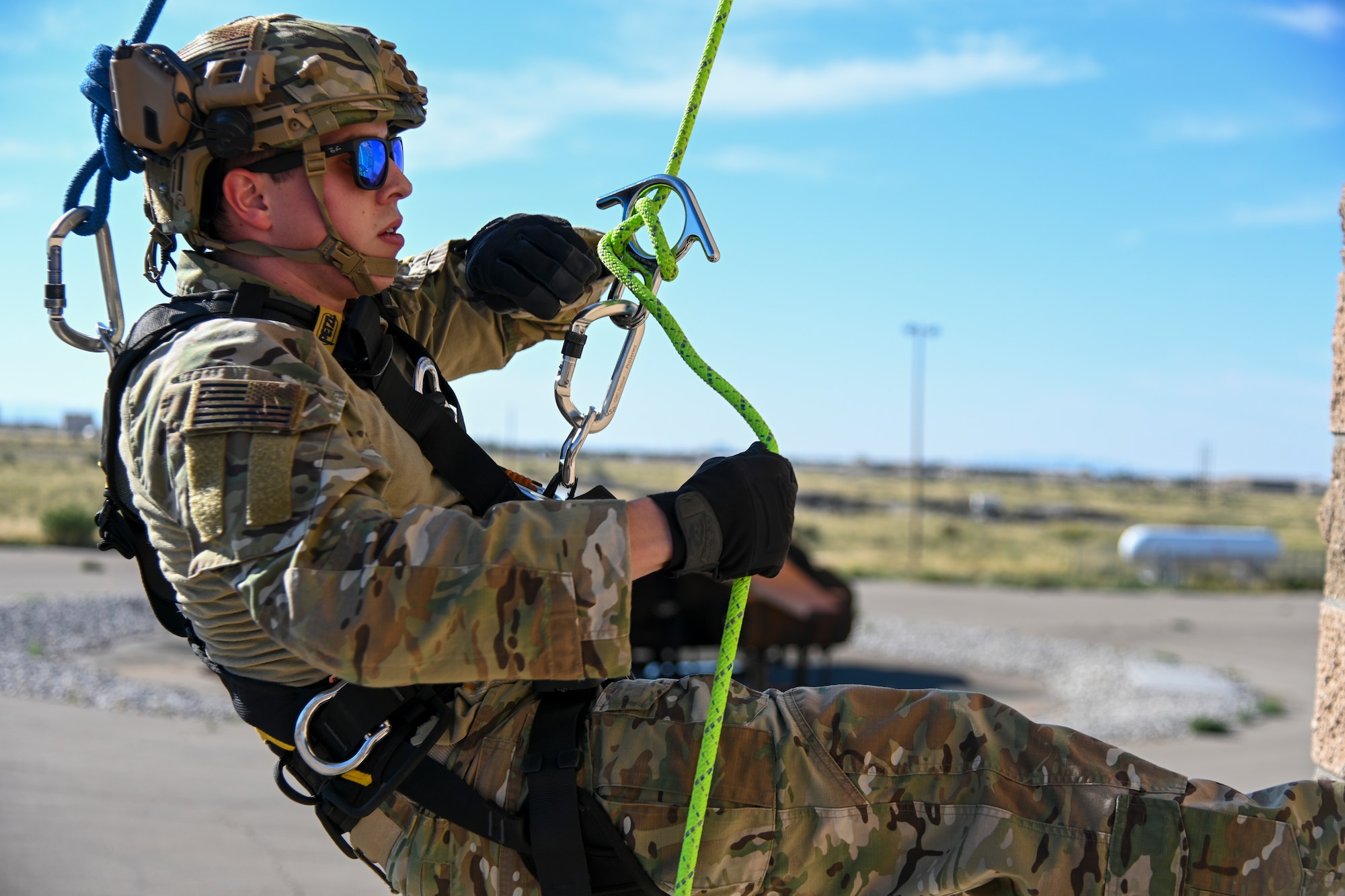 Staff Sgt. Steven Chaney, 49th Security Forces Squadron patrolman, adjusts his rope length during the 49th Wing’s first rappel skills training, Oct. 5, 2021, on Holloman Air Force Base, New Mexico. Holloman defenders and firefighters learned about different ropes and knots to use to rappel in hostile or dangerous situations. (U.S. Air Force photo by Airman 1st Class Jessica Sanchez-Chen)