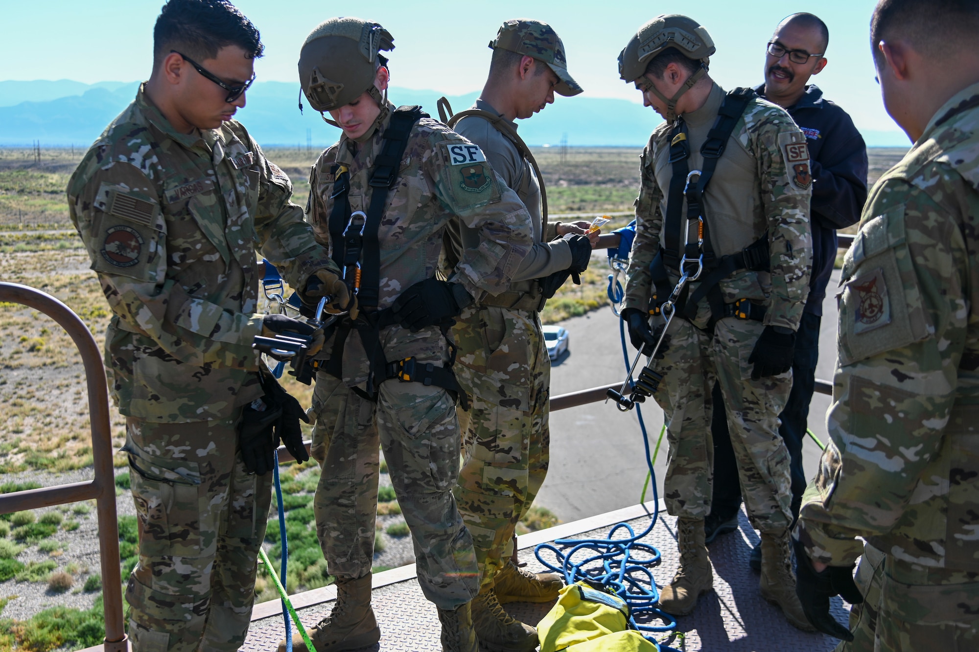 Members from the 49th Security Force Squadron and 49th Civil Engineer Squadron participated in the 49th Wing’s first rappel skills training, Oct, 5, 2021, on Holloman Air Force Base, New Mexico. The training lasted two days, with one full day for learning anchors, knots, purpose, how to maintain the ropes and becoming familiarized with the equipment for rapid entry from buildings during hostile or dangerous situations. (U.S. Air Force photo by Airman 1st Class Jessica Sanchez-Chen)