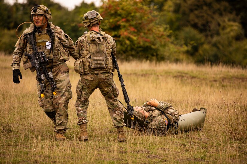 U.S. Army Soldiers assigned to Alpha Company, 1st Battalion, 16th Infantry Regiment “Iron Rangers,” 1st Armored Brigade Combat Team, 1st Infantry Division, move a simulated casualty during a multinational situational training exercise in Cincu, Romania