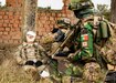 A U.S. Army Soldier assigned to Alpha Company, 1st Battalion, 16th Infantry Regiment “Iron Rangers,” 1st Armored Brigade Combat Team, 1st Infantry Division, and a Portuguese Soldier provide tactical medical care for a simulated casualty in Cincu, Romania