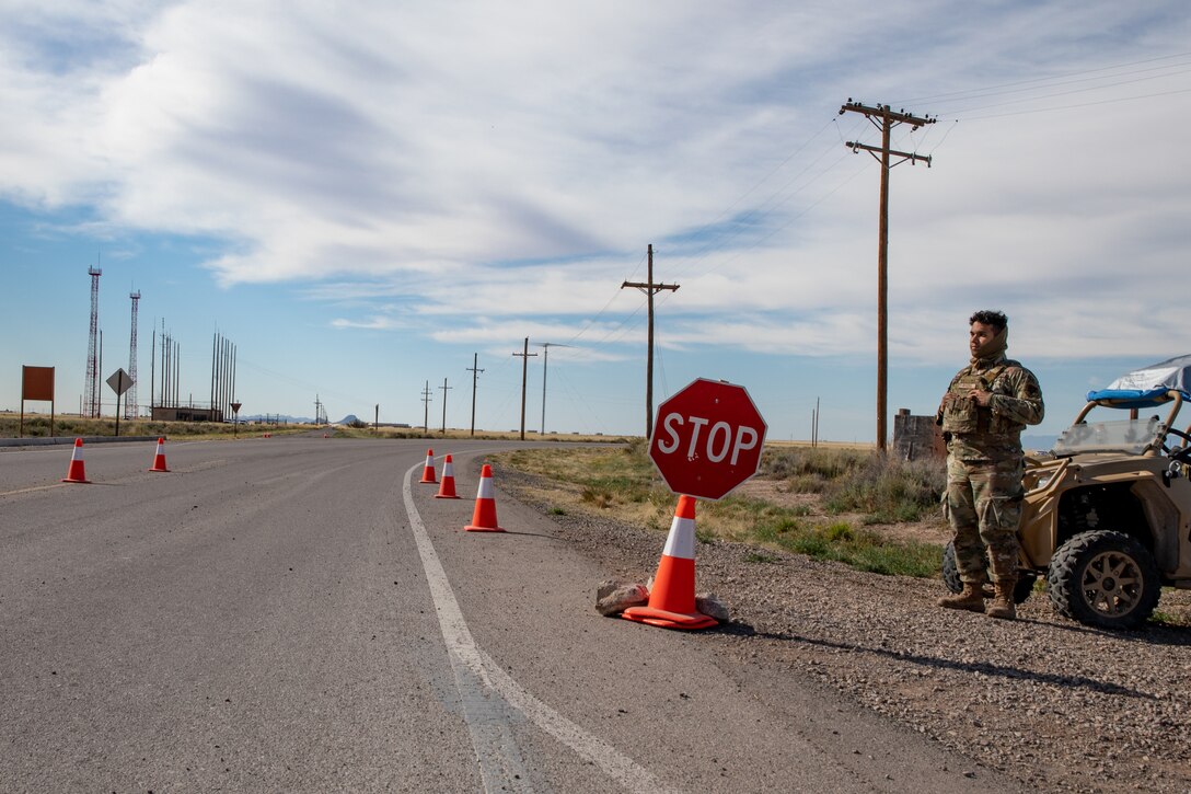 An Airman deployed with the 822nd Base Defense Squadron from Moody Air Force Base, Georgia, provides force protection to Aman Omid Village on Holloman Air Force Base, New Mexico, Oct. 7, 2021. The Department of Defense, through the U.S. Northern Command, and in support of the Department of State and Department of Homeland Security, is providing transportation, temporary housing, medical screening, and general support for at least 50,000 Afghan evacuees at suitable facilities, in permanent or temporary structures, as quickly as possible. This initiative provides Afghan evacuees essential support at secure locations outside Afghanistan. (U.S. Army photo by Spc. Nicholas Goodman)