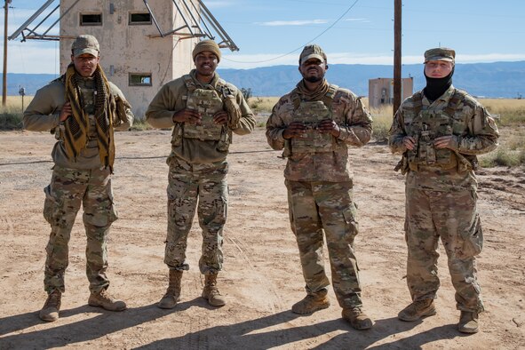 Airmen deployed with the 822nd Base Defense Squadron from Moody Air Force Base, Georgia, provide force protection to Aman Omid Village on Holloman Air Force Base, New Mexico, Oct. 7, 2021.  The Department of Defense, through the U.S. Northern Command, and in support of the Department of State and Department of Homeland Security, is providing transportation, temporary housing, medical screening, and general support for at least 50,000 Afghan evacuees at suitable facilities, in permanent or temporary structures, as quickly as possible. This initiative provides Afghan evacuees essential support at secure locations outside Afghanistan. (U.S. Army photo by Spc. Nicholas Goodman)