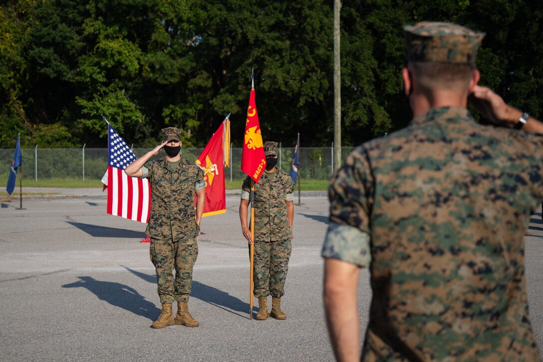 U.S. Marine Corps 1stLt. Luke Walker, an air defense control officer with Early Warning and Control Detachment (EW/C), Marine Air Control Squadron 2, Marine Air Control Group 28, 2nd Marine Aircraft Wing, reports to Maj. Zachary Germershausen, the off-going detachment commander, during a change of command ceremony for the EW/C detachment at Marine Corps Air Station Beaufort, South Carolina, Oct. 1, 2021. Maj. Zachary Germershausen relinquished command to Capt. Caleb Marshall after leading the detachment for two years. (U.S. Marine Corps photo by Lance Cpl. Nicholas Buss)