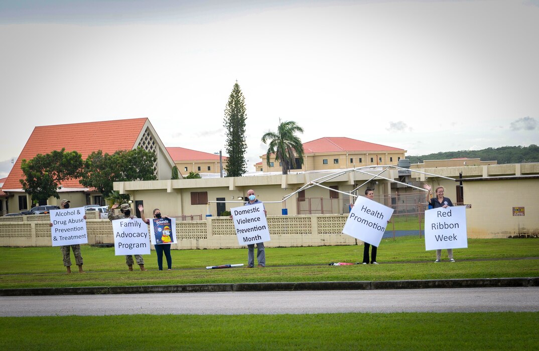 Members of Team Andersen participate in an awareness wave on Andersen Air Force Base, Guam, Oct. 4, 2021.