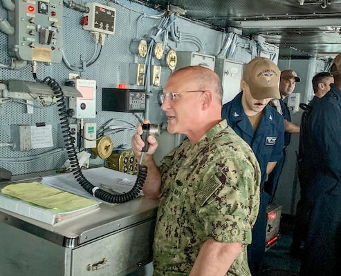 BAY OF BENGAL (Oct. 14, 2021) Chief of Naval Operations Adm. Mike Gilday addresses the crew of the USS Carl Vinson (CVN 70) during Exercise Malabar. MALABAR is a maritime exercise designed to improve integration, address common maritime security priorities and concerns, enhance interoperability and communication, and strengthen enduring relationships between the Royal Australian Navy, Royal Indian Navy, Japan Maritime Self-Defense Force, and U.S. maritime forces. (U.S. Navy photo by Cmdr. Nate Christensen/Released)