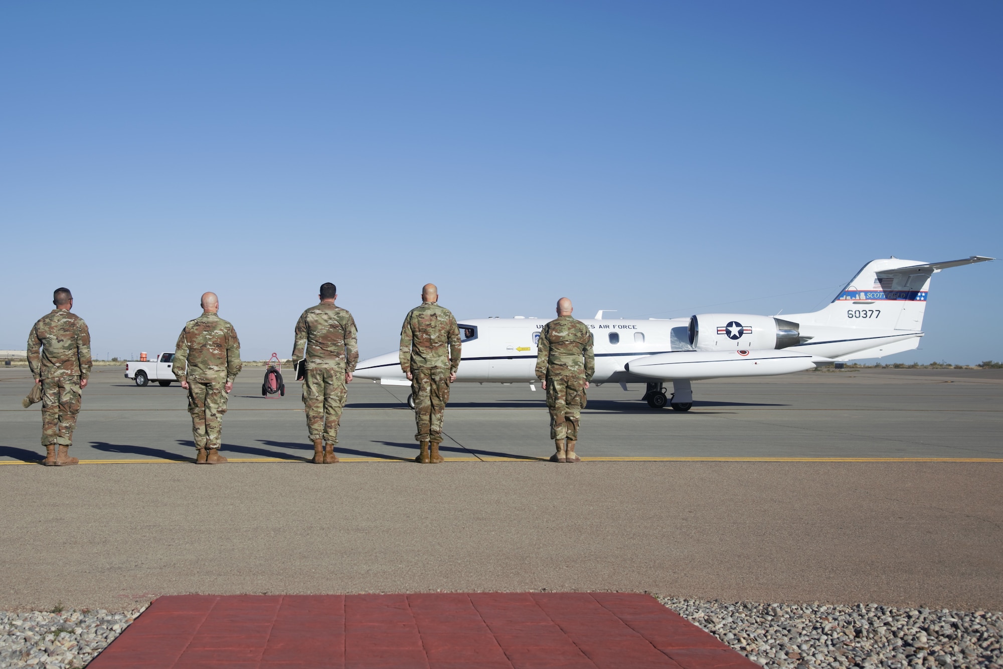 Task Force-Holloman and 49th Wing leadership standby to greet Chief Master Sgt. of the Air Force JoAnne S. Bass as she arrives on Holloman Air Force Base, New Mexico, Oct. 13, 2021. The Department of Defense, through U.S. Northern Command, and in support of the Department of State and Department of Homeland Security, is providing transportation, temporary housing, medical screening, and general support for at least 50,000 Afghan evacuees at suitable facilities, in permanent or temporary structures, as quickly as possible. This initiative provides Afghan evacuees essential support at secure locations outside Afghanistan. (U.S. Navy photo by Mass Communications Specialist 1st Class Sarah Rolin)