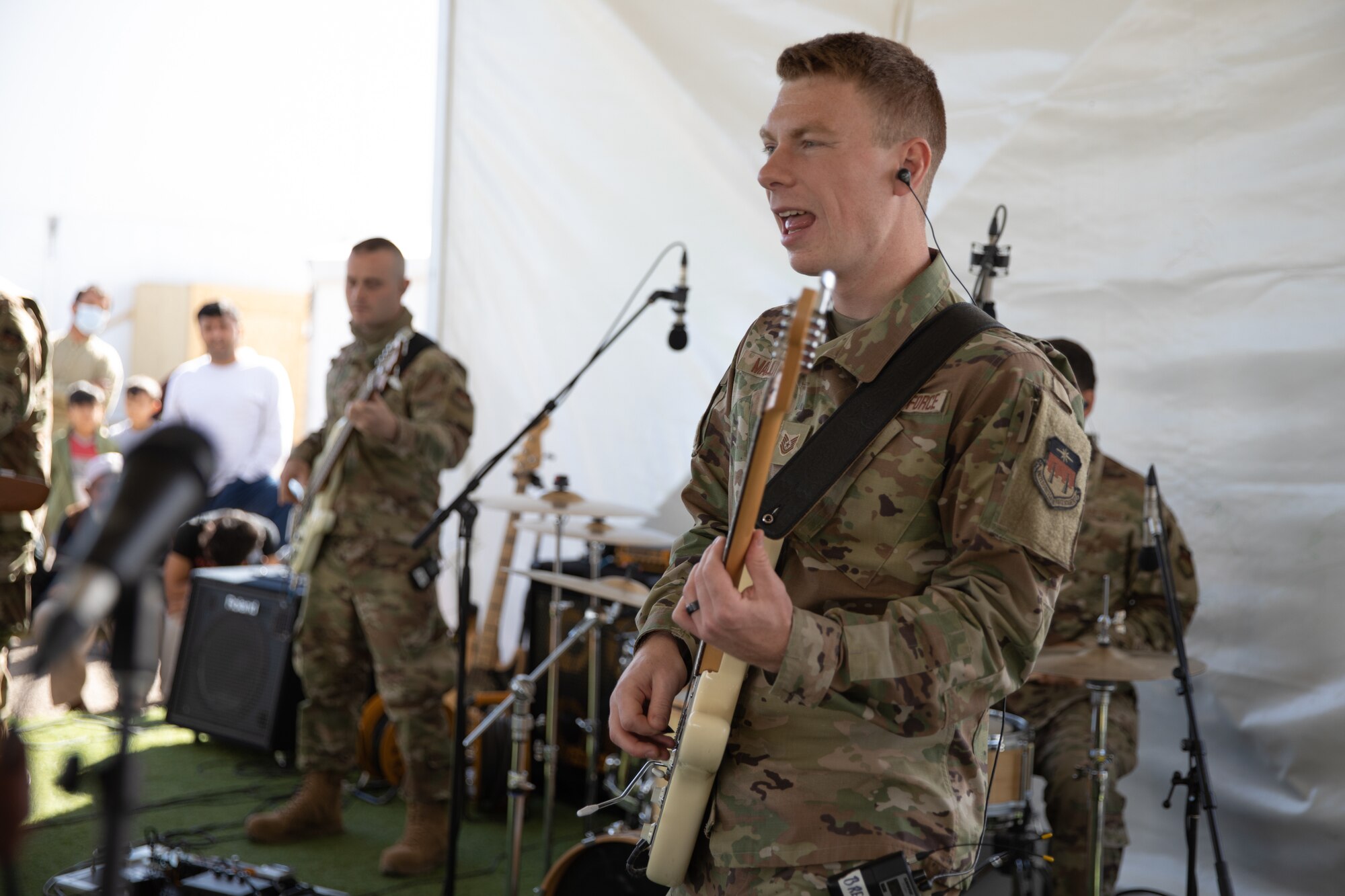 Delta Blue from the U.S. Air Force Academy, performs at Aman Omid Village for Afghan evacuees on Holloman Air Force Base, New Mexico, Oct. 13, 2021. The Department of Defense, through the U.S. Northern Command, and in support of the Department of State and Department of Homeland Security, is providing transportation, temporary housing, medical screening, and general support for at least 50,000 Afghan evacuees at suitable facilities, in permanent or temporary structures, as quickly as possible. This initiative provides Afghan evacuees essential support at secure locations outside Afghanistan. (U.S. Army photo by Spc. Nicholas Goodman)