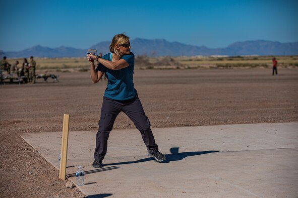 Col. Meredith Seeley, Task Force-Holloman deputy commander deployed from MacDill Air Force Base, Florida, plays during a cricket game between U.S. service members and Afghan evacuees at Aman Omid Village on Holloman Air Force Base, New Mexico, Oct. 9, 2021. The Department of Defense, through U.S. Northern Command, and in support of the Department of Homeland Security, is providing transportation, temporary housing, medical screening, and general support for at least 50,000 Afghan evacuees at suitable facilities, in permanent or temporary structures, as quickly as possible. This initiative provides Afghan personnel essential support at secure locations outside Afghanistan. (U.S. Army photo by Pfc. Anthony Sanchez)