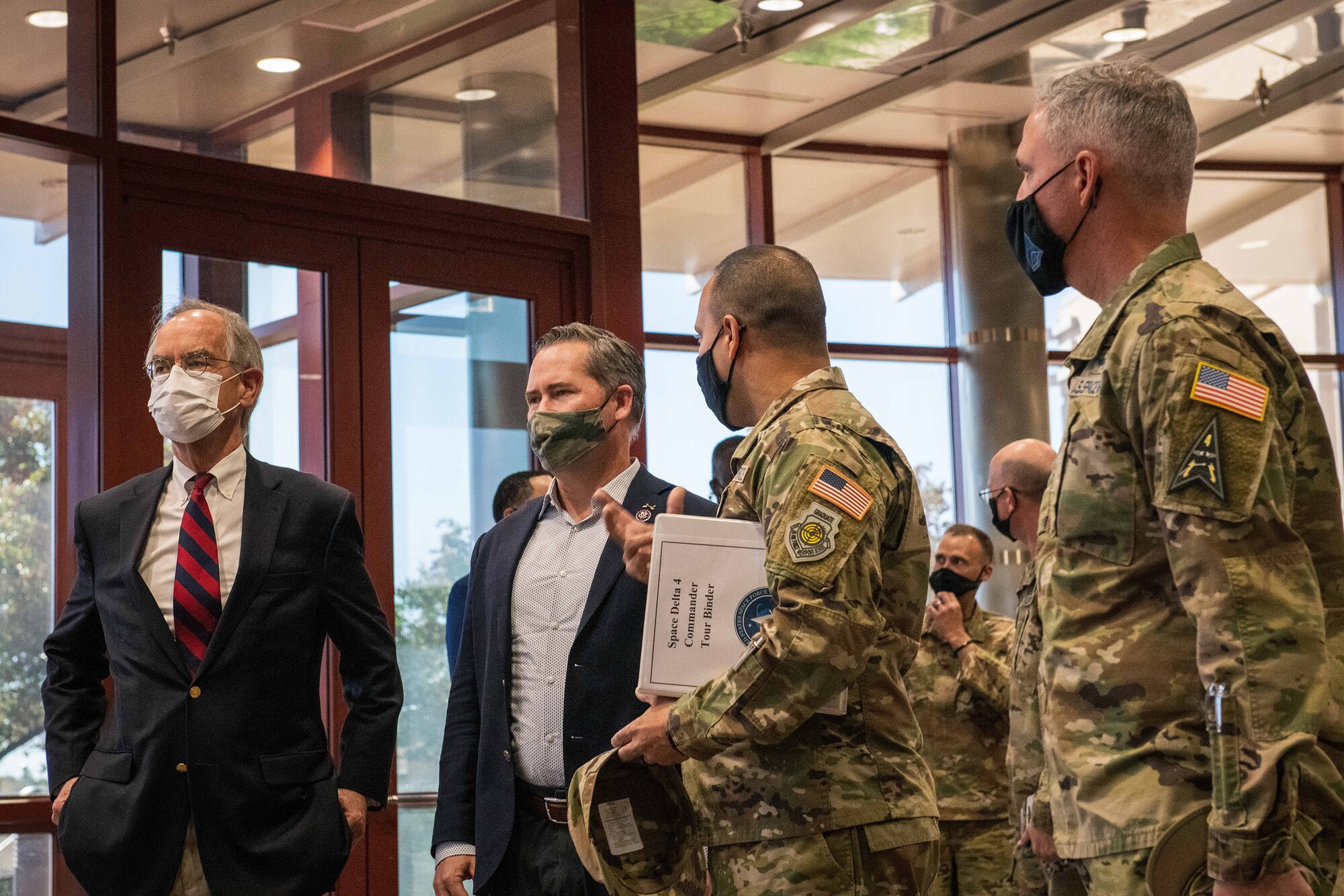 From left to right, Congressman Jim Cooper, the U.S. Representative for Tennessee’s 5th congressional district, and Congressman Michael Waltz, the U.S. Representative for Florida’s 6th congressional district, are briefed by U.S. Space Force Col. Miguel Cruz, the Space Delta 4 commander, and USSF Lt. Gen. Stephen Whiting, the Space Operations Command commander, on the functions of a Defense Support Program satellite on Oct. 13, 2021, in the Mission Control Station lobby on Buckley Space Force Base, Colo. The DSP satellites were first launched and operated in the 1970’s and have continued to provide an uninterrupted space-based early warning capability. (U.S. Space Force photo by Senior Airman Joshua T. Crossman)