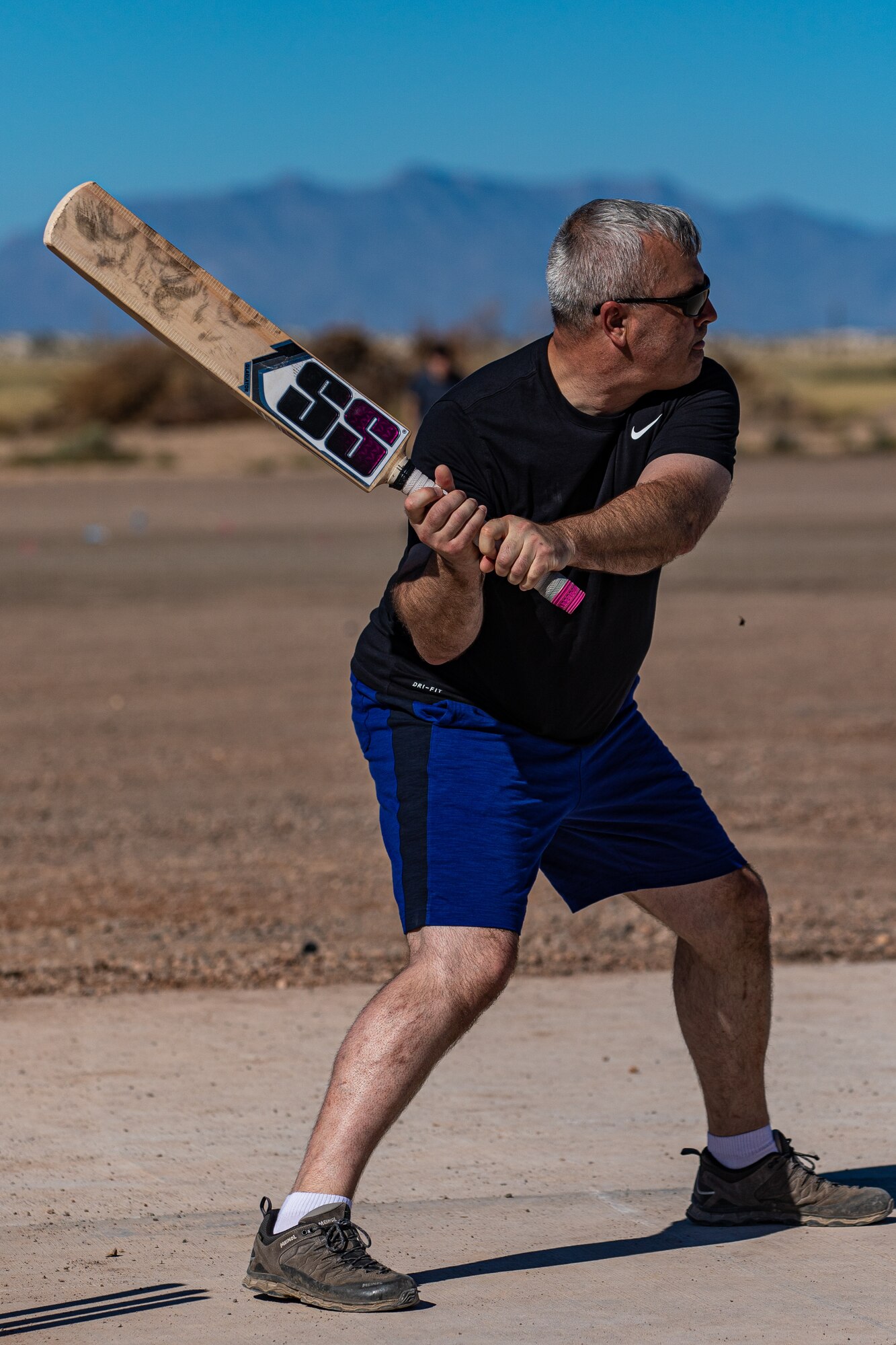 Col. Kent Harbough, Task Force-Holloman chief of staff deployed from Battle Creek Air National Guard Base, Michigan, prepares to bat during a cricket game between U.S. service members and Afghan evacuees at Aman Omid Village on Holloman Air Force Base, New Mexico, Oct. 9, 2021.The Department of Defense, through U.S. Northern Command, and in support of the Department of Homeland Security, is providing transportation, temporary housing, medical screening, and general support for at least 50,000 Afghan evacuees at suitable facilities, in permanent or temporary structures, as quickly as possible. This initiative provides Afghan personnel essential support at secure locations outside Afghanistan. (U.S. Army photo by Pfc. Anthony Sanchez)