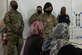 Chief Master Sgt. of the Air Force JoAnne S. Bass greets Afghan students during their English lessons at Aman Omid Village as part of a visit to Task Force-Holloman on Holloman Air Force Base, New Mexico, Oct. 13, 2021. The Department of Defense, through U.S. Northern Command, and in support of the Department of State and Department of Homeland Security, is providing transportation, temporary housing, medical screening, and general support for at least 50,000 Afghan evacuees at suitable facilities, in permanent or temporary structures, as quickly as possible. This initiative provides Afghan evacuees essential support at secure locations outside Afghanistan. (U.S. Navy photo by Mass Communications Specialist 1st Class Sarah Rolin)