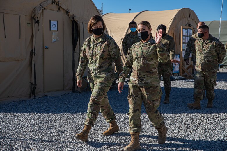 Chief Master Sgt. of the Air Force JoAnne S. Bass visits Task Force-Holloman’s Life Support Area as part of a visit to Holloman Air Force Base, New Mexico, Oct. 13, 2021. The Department of Defense, through U.S. Northern Command, and in support of the Department of Homeland Security, is providing transportation, temporary housing, medical screening, and general support for at least 50,000 Afghan evacuees at suitable facilities, in permanent or temporary structures, as quickly as possible. This initiative provides Afghan personnel essential support at secure locations outside Afghanistan. (U.S. Army photo by Pfc. Anthony Sanchez)