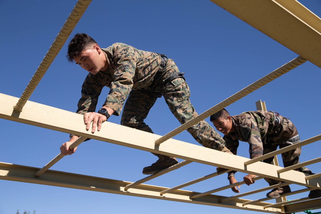 U.S Marine Corps Lance Cpl. Aaron Bertrand, a native of Warner Robins, Ga., with 1st Battalion, 6th Marine Regiment, 2d Marine Division, participates in an obstacle course during Exercise Baccarat on Caserne Colonel de Chabrières Nîmes, France, Oct. 8, 2021. Exercise Baccarat is a three-week joint exercise between 2d MARDIV and the French Foreign Legion that challenges forces with physical and tactical training, as well as provides the opportunity to exchange knowledge that assists in developing and strengthening bonds. (U.S. Marine Corps photo by Lance Cpl. Jennifer E. Reyes)