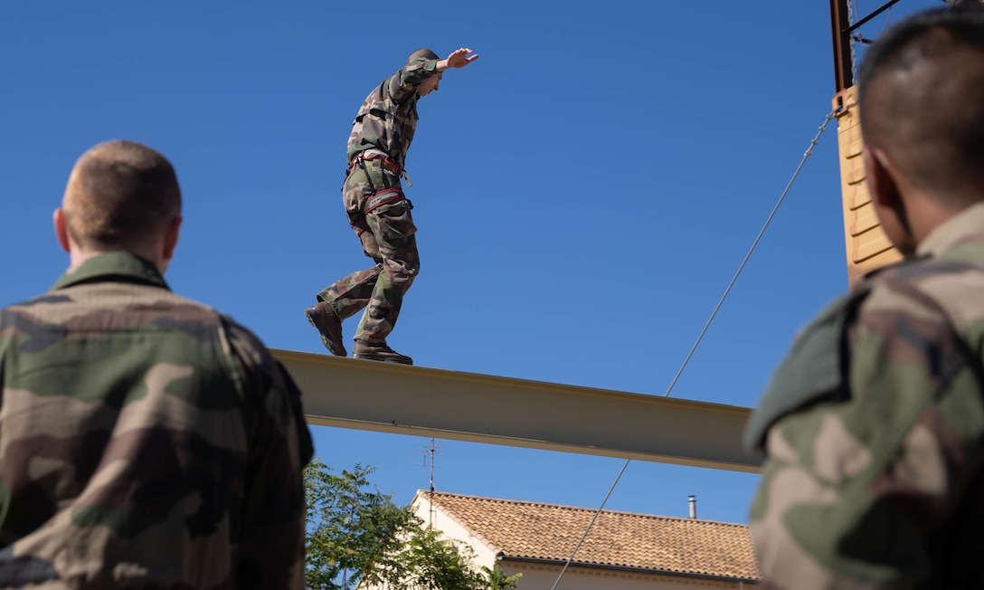 A French Legionnaire with the 2d Infantry Regiment, French Foreign Legion, participates in an obstacle course, during Exercise Baccarat on Caserne Colonel de Chabrières Nîmes, France, Oct. 8, 2021. Exercise Baccarat is a three-week joint exercise between 2d MARDIV and the French Foreign Legion that challenges forces with physical and tactical training, as well as provides the opportunity to exchange knowledge that assists in developing and strengthening bonds. (U.S. Marine Corps photo by Lance Cpl. Jennifer E. Reyes)