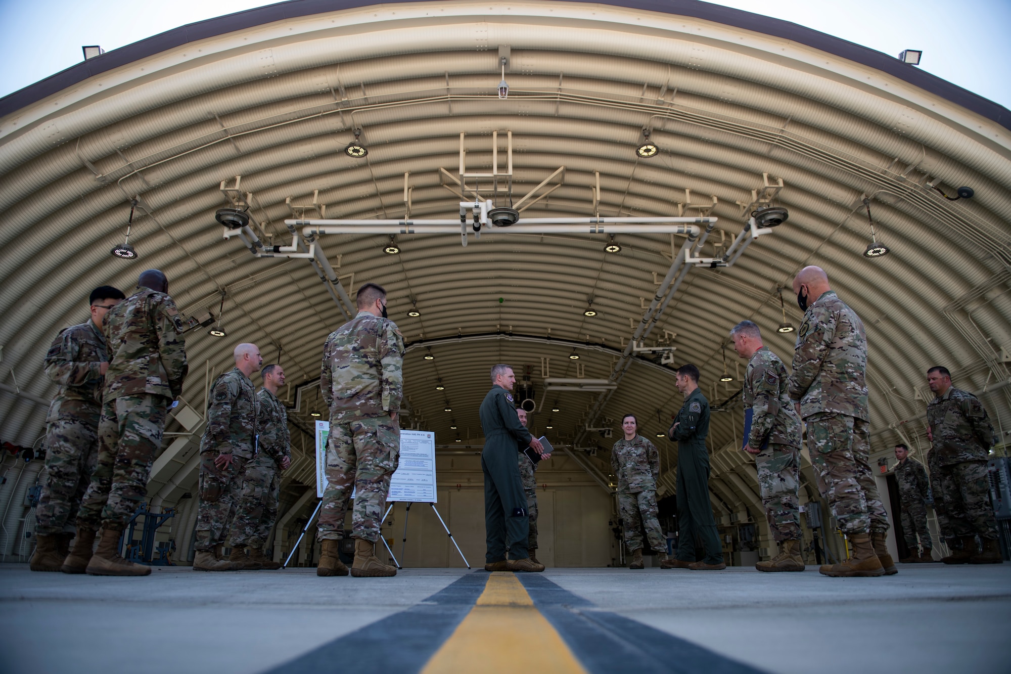 Brig. Gen. Jason Rueschhoff, 7th Air Force deputy commander, receives a briefing about third generation hardened aircraft shelters at Kunsan Air Base, Republic of Korea, Oct. 14, 2021. Rueschhoff visited the 8th Fighter Wing for an immersion tour to learn more about the Wolf Pack mission, welfare, readiness and capabilities. (U.S. Air Force photo by Senior Airman Suzie Plotnikov)