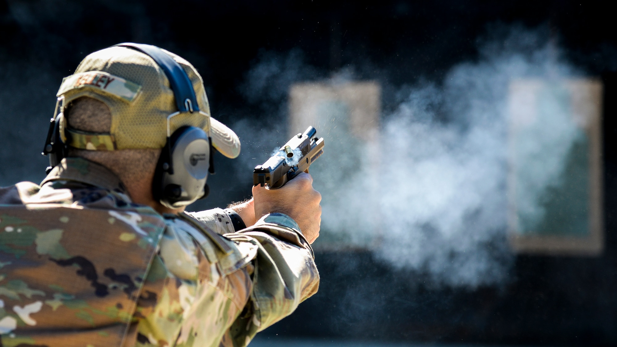 U.S. Air Force Senior Master Sgt. Justin Kelley, 177th Operations Squadron C2 operations senior enlisted leader, fires a Sig Sauer P320-M18 handgun Sep. 24, 2021, at the FAA William J. Hughes Technical Center, Egg Harbor Township, N.J. Members of the 177th FW went to the range to qualify for the M18 and gain the perspective of the Airmen who will carry it. (U.S. Air National Guard photo by Senior Airman Hunter Hires)