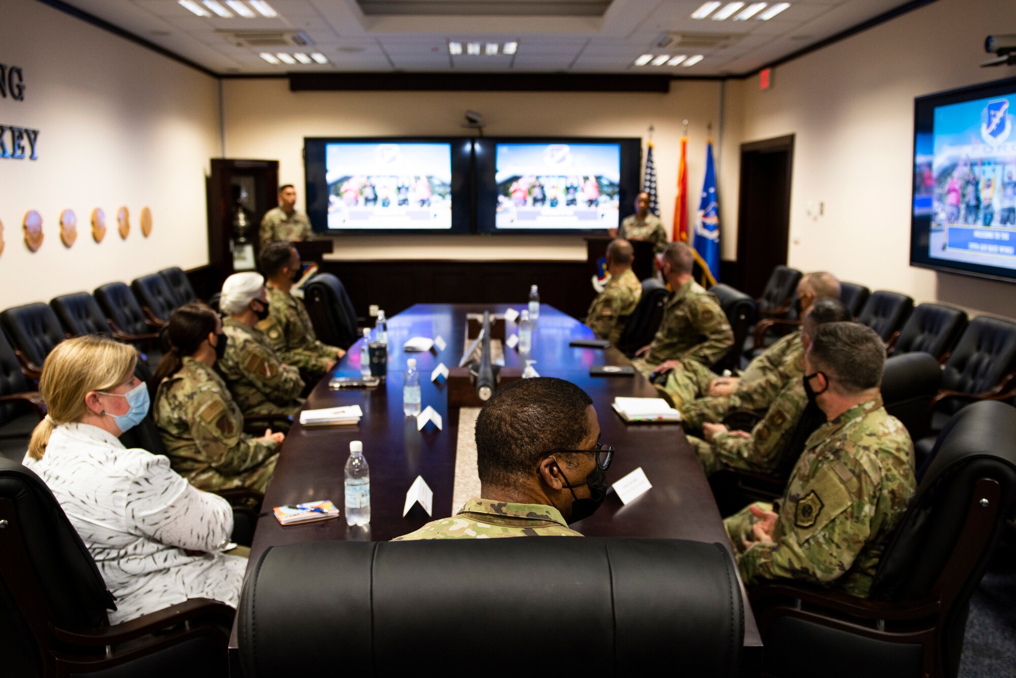military members sitting in a meeting