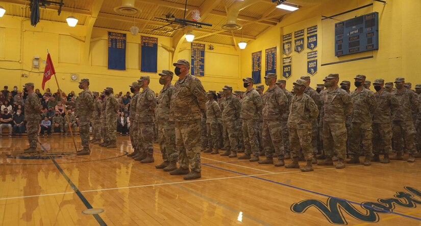 Soldiers from the 228th Engineer Company, 337th Engineer Battalion, 55th Maneuver Enhancement Brigade, stand in formation during their deployment departure ceremony at Northern Lebanon High School on October 12, 2021. The Soldiers were supported by friends, family, and fellow service members, that attended to support the Soldiers of the 228th on their mission (U.S. Army photo by Sgt. 1st Class Matthew Keeler).