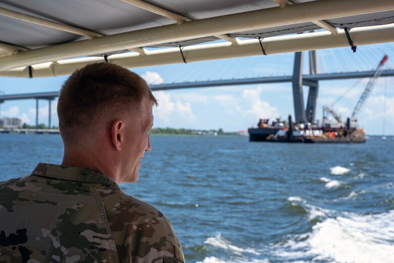 Lt. Col. Andrew Johannes, the commander for the U.S. Army Corps of Engineers Charleston District, observes a dredger under the Arthur Ravenel Jr. Bridge during a tour of the Charleston Harbor Post 45 Deepening Project.